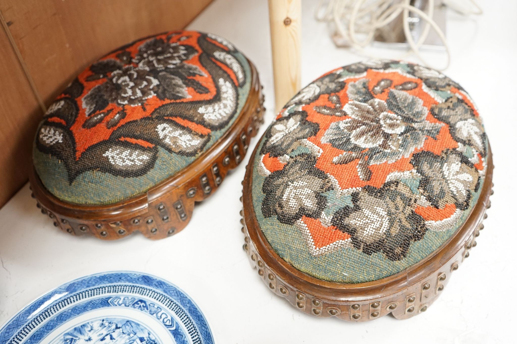 A pair of Berlin beadwork footstools, 38cm